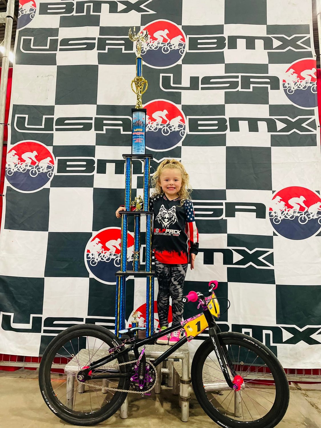 Henley Greer poses with her  national BMX trophy after she claimed the USA BMX girls 5-years-old and under title in Tulsa, Oklahoma, last month.